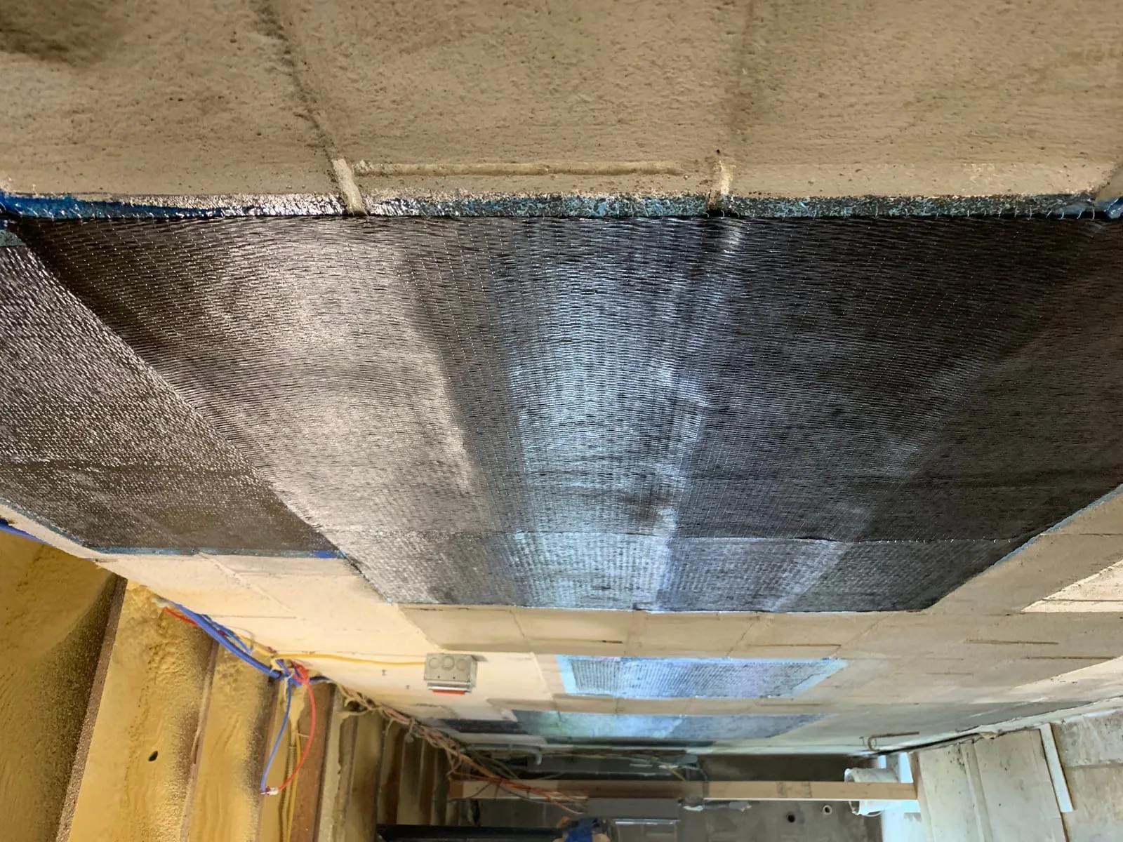 Second view of completed masonry waterproofing repair on basement wall