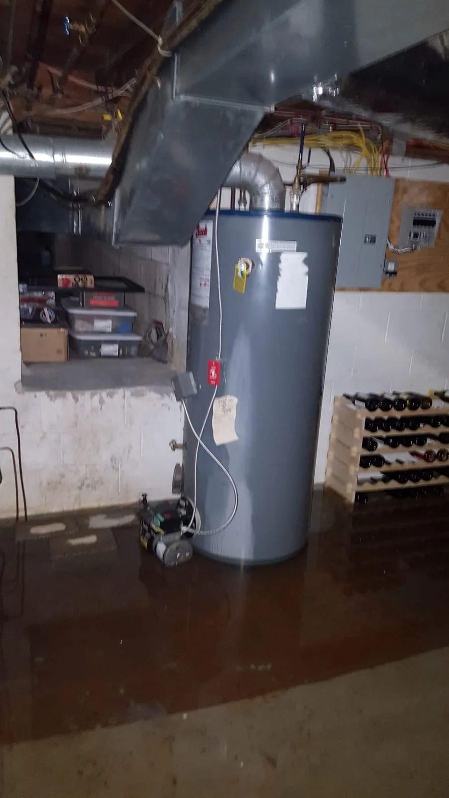 Severely flooded basement with several inches of standing water in Greenwich CT home