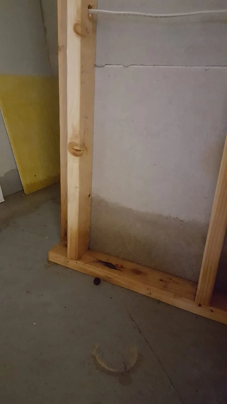 Standing water across a basement floor after a sump pump failure in a Fairfield County home